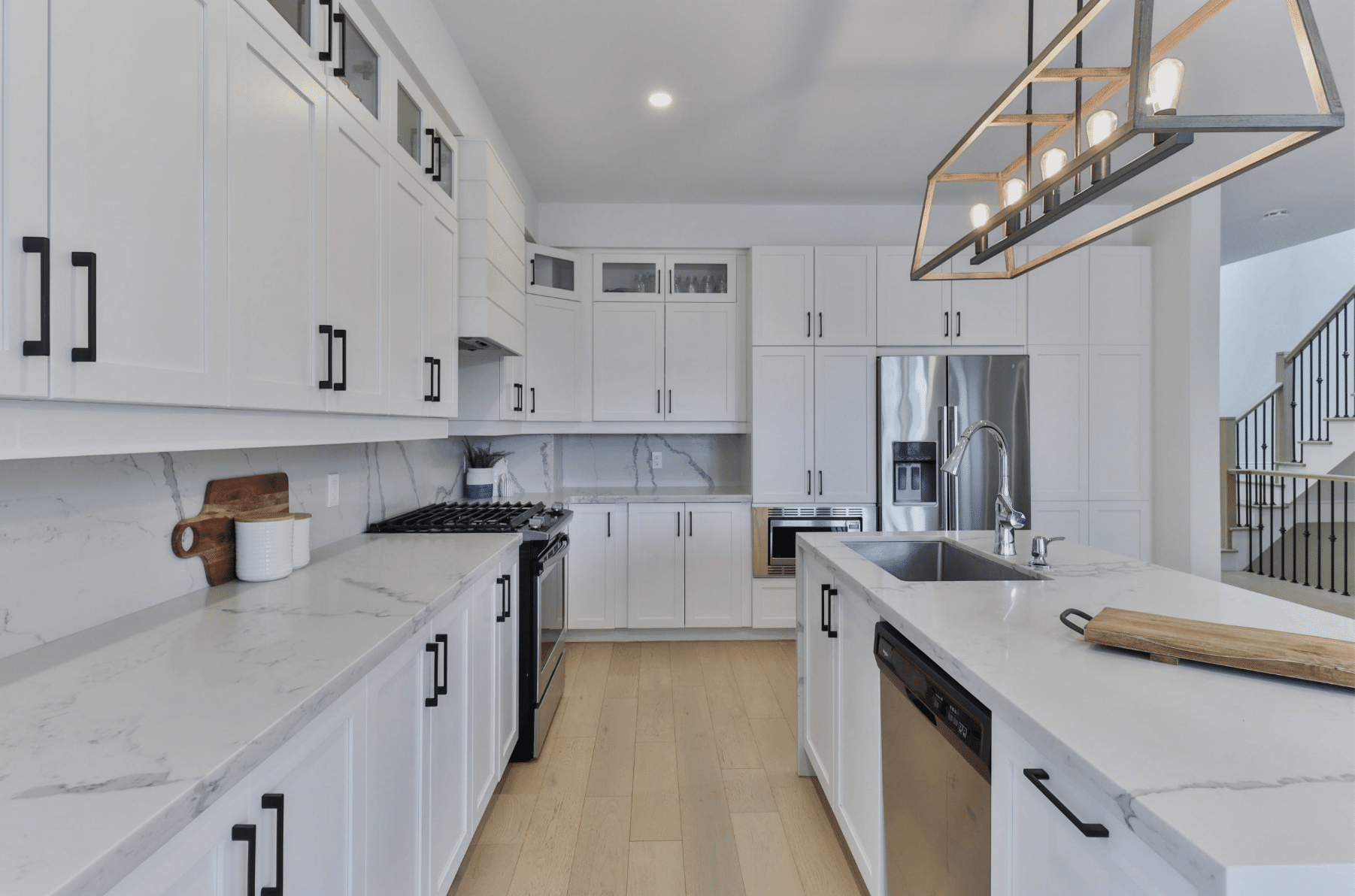 Elegant white kitchen in spacious aging-in-place house.