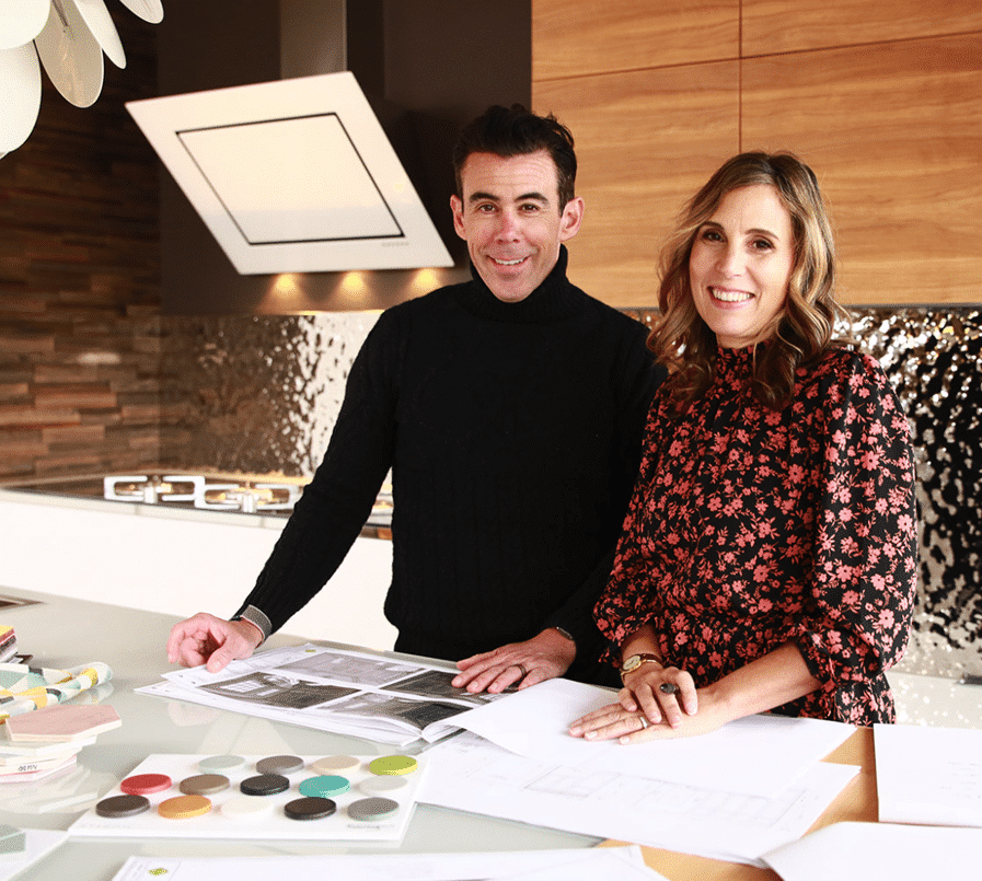 Anne and Kevin Capozzi designing a new kitchen on a crowded kitchen island.